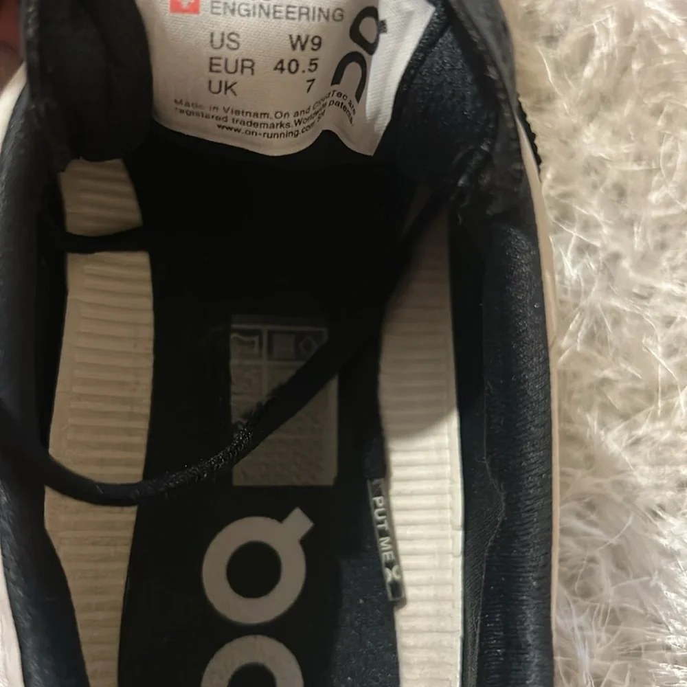 On Running Black and Cream Athletic Shoes